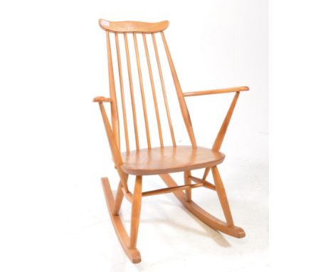 Ercol Furniture - Model 435 - A mid 20th century Ercol beech and elm spindle back goldsmith rocking chair. The chair featurin