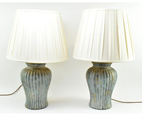 A pair of British Modern Design contemporary ceramic baluster ribbed vase table lamps lights. Each lamp having a ribboned cyl