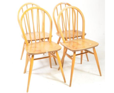 Lucian Ercolani for Ercol Furniture - A set of 4 mid century Ercol beech and elm wood dining chairs. Raised on turned taperin