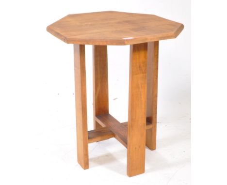 An early 20th centutry Arts &amp; Crafts oak pedestal side occasional table in the manner of Liberty of London. The table hav