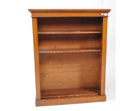 A Victorian 19th century mahogany open window bookcase. Raised on a plinth base with central shelves having flared pediment s