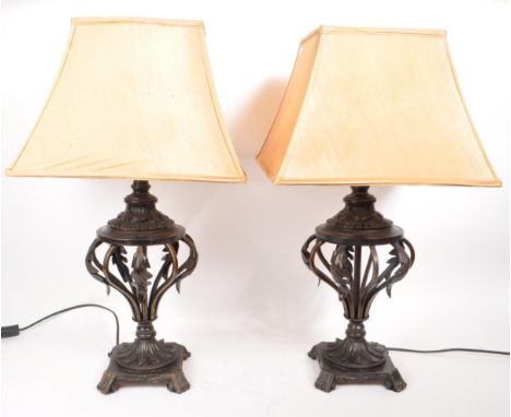 A pair of contemporary Art Nouveau style pierced table lamp lights. Square tapering shades with pierced bulbous column with f