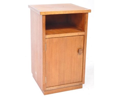 British Modern Design - A mid century teak wood pedestal bedside cabinet. Raised on a plinth base with single locker door and