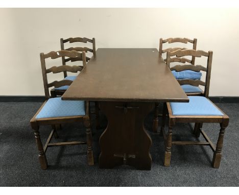 An oak refectory table together with a set of five oak ladder back chairs 