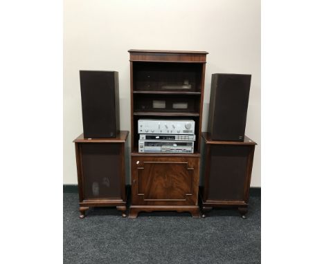 A three piece technics system on a set of Bradley bookshelves, fitted a cupboard beneath, a pair of teak cased Kef speakers a