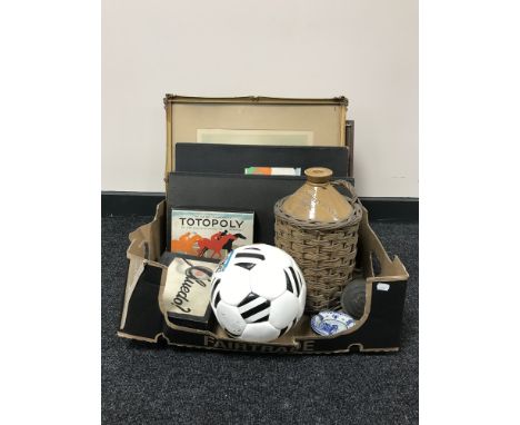 A box containing a lithograph depicting the Royal Baccarat Scandal, vintage Totopoly game, Cluedo, signed NUFC football, ston