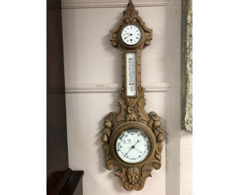 A 19th century carved oak barometer 