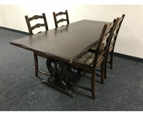 An oak refectory dining table, together with a set of four ladder back chairs
