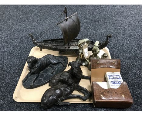 A painted metal Viking longboat, two resin figures of dogs, 19th century brass weights, Dekon playing cards etc