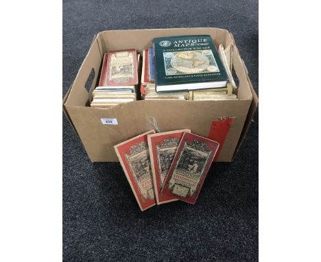 A box containing vintage ordnance survey maps, together with one volume of 'Antique Maps A Collectors guide' 
