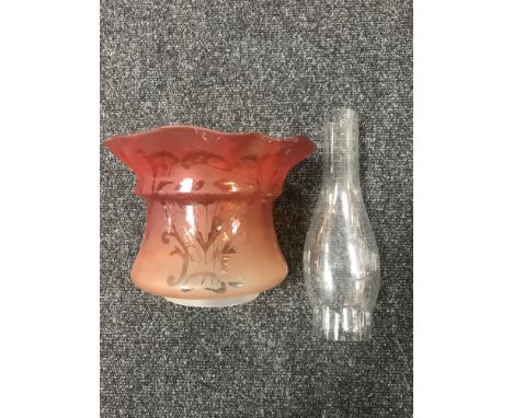A Victorian glass oil lamp shade (orange) together with a glass chimney