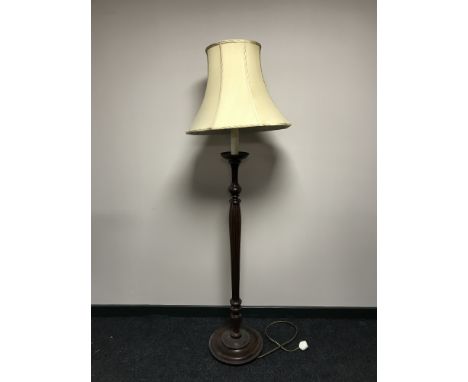 A contemporary standard lamp with shade