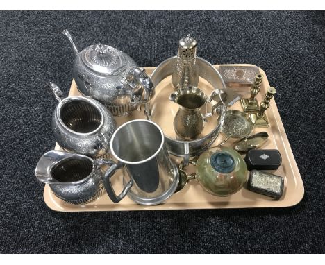 A tray containing a three piece Walker and Hall Sheffield plate embossed tea service, a hammered pewter jug and sugar sifter,
