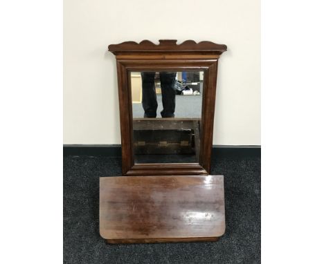 A late 19th century mahogany wall mirror with shelf 