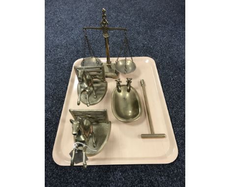 A tray containing a set of brass balance scales, a pair of brass horse bookends, together with a brass bath and T key