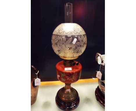 A Victorian oil lamp with painted reservoir, lustre base and etched glass shade  