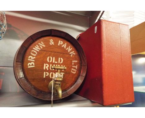 A mid-20thC fitted picnic hamper together with a coopered spirit barrel for Brown & Pank Old Ruby Port