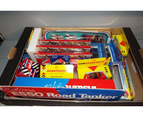 A mixed selection of model cars and trucks to include 'The Esso Road Tanker', Corgi die-cast vehicles etc 