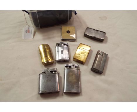A selection of assorted lighters, snuff box and match holder