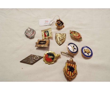 A collection of ten French metal and enamel military badges 