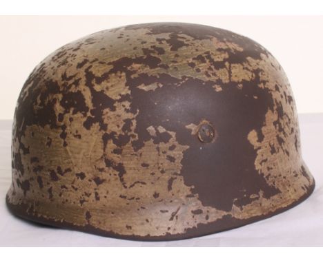 Luftwaffe Fallschirmjager (Paratroopers) Camouflaged Steel Combat Helmet, which retains approximately 65% of its original gre