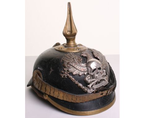 Imperial German Pickelhaube being a leather shell with officers scaled chinstraps and officers pattern cockades. Prussian eag