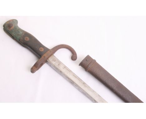 French Gras Bayonet, complete with its original scabbard. Blade spine is engraved with makers mark and date 1879. Blade remai