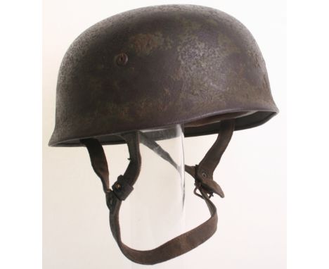 Luftwaffe Falschirmjager Paratroopers Steel Combat Helmet, the helmet has just remains of a Normandy style camouflage paint f