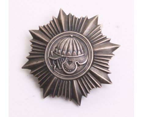 Pre War Polish 5th Armoured Breast Badge, being a white metal two piece badge with armoured helmet set upon a rayed eight poi