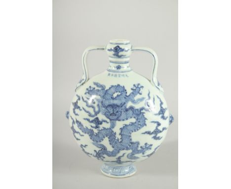 A CHINESE BLUE AND WHITE TWIN HANDLE MOON FLASK with dragon to each side. 28ins high.