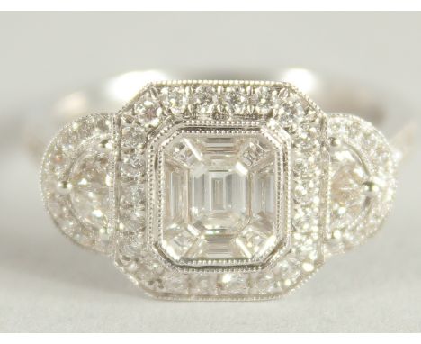 AN 18 CARAT WHITE GOLD AND DIAMOND RING. (Total diamond weight approx. 1.2 carat)