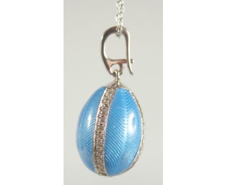 A TATIANA FABERGE STERLING SILVER AND ENAMEL EGG SHAPE PENDANT AND CHAIN.