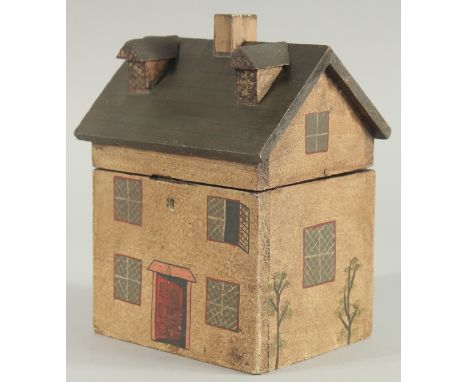 A REPLICA WOODEN HOUSE TEA CADDY. 8.5ins high.