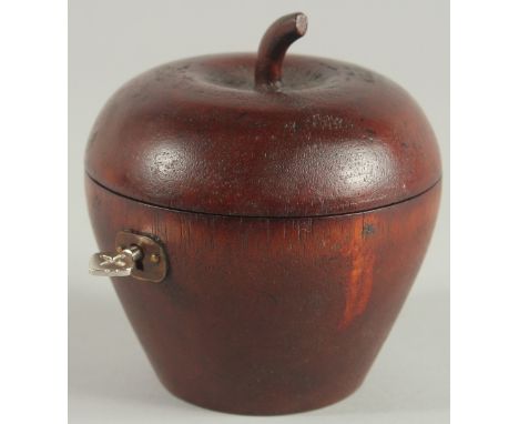 A WOODEN APPLE TEA CADDY. 4.5ins high.