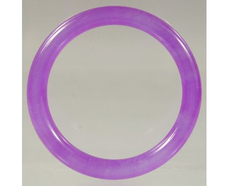 A CHINESE LAVENDER JADE BANGLE 3ins diameter.