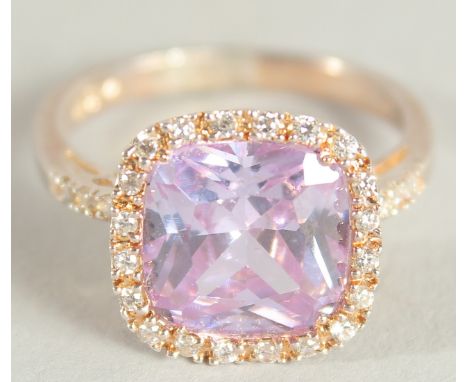A SILVER AMETHYST C Z RING.
