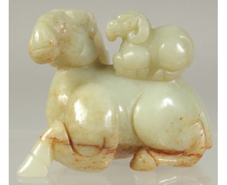 A CHINESE CARVED JADE RAM AND YOUNG. 2.25ins.