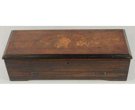 A GOOD SWISS MUSICAL BOX in an inlaid rosewood case, playing 8 airs. Drum 10.75ins long, case 1ft 6ins long.