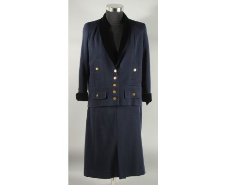 A CHANEL NAVY BLUE TWO PIECE SKIRT SUIT. Size 42 with velvet trim to jacket and gilt Chanel button, (skirt has been altered a