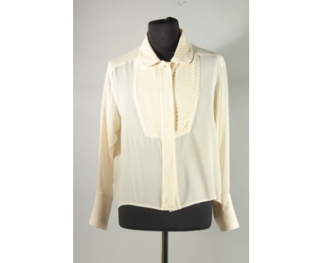 A CHANEL CREAM SILK BLOUSE, dress shirt front and double cuffs. Size label worn, approx. UK 14. Some staining to front.