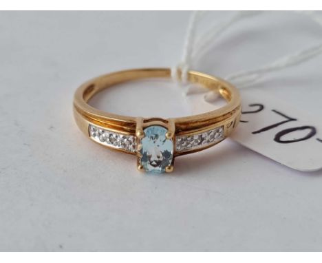 A oval aquamarine ring with diamond shoulders 10ct gold size S – 2.3 gms