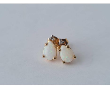 A pair of opal and diamond earrings 14ct gold – 1.3 gms 