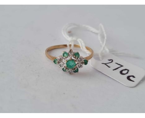 A emerald and diamond vintage cluster ring 9ct size N