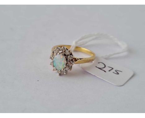 An opal and diamond cluster ring in 18ct gold size L 3.3g inc