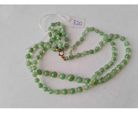 A Edwardian jade bead necklace with 9ct clasp and crystal spacers 