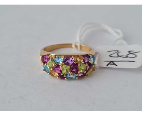 A 9ct Tutti-Frutti multi gem set ring with peridot blue topaz amethyst and citrine size R ½ – 3.5 gms