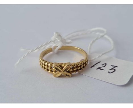 A fancy ribbon ring 14ct gold size K ½ – 2 gms 