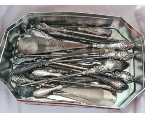 A large box of collection of button hooks, glove stretchers etc