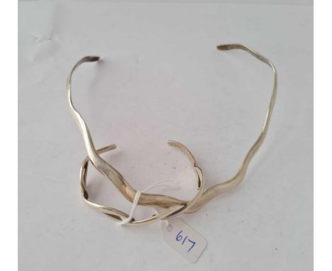 A matching set of silver wavy torque necklace and bangle 
