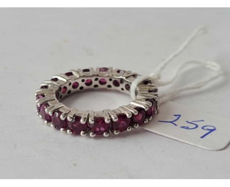 A silver and ruby eternity ring size O 